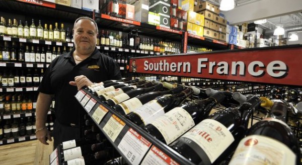 BevMax CEO Mike Berkoff poses in one of his liquor stores in Stamford. The retail liquor chain has been fighting to eliminate the minimum-pricing laws in the state. Photo by Jason Rearick