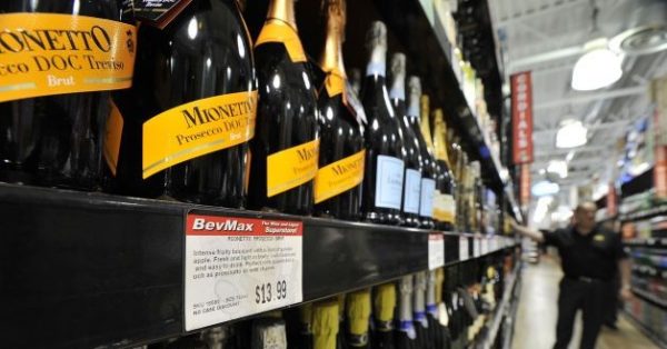 Bottles of Mionetto prosecco at the BevMax liquor store in Stamford. CEO Mike Berkoff says the sparkling wine, now priced at $13.99, could be sold for $9.95 if there were no minimum price restrictions. Photo by Jason Rearick