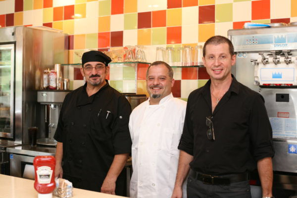 From left, head chef Dino Katechis and co-owners Billy Michialis and Spiros Patsis Argyros of the Ardsley Diner. Photo by Evan Fallor