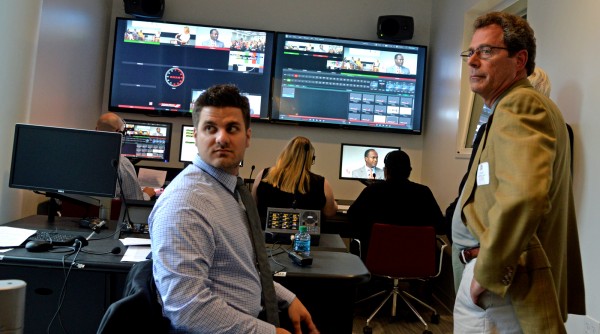 Student Tom Naclerio and Professor Joe Alicastro work in one of the Martire Business and Communications Center”™s control rooms. Photo by Tracy Deer-Mirek