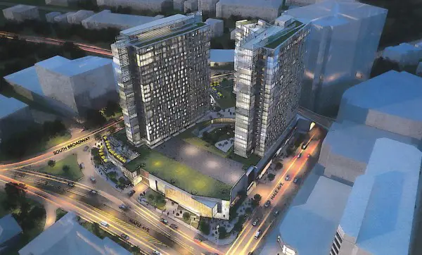 An architect”™s rendering of the 60 S. Broadway development viewed at dusk. 