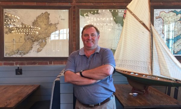 Les Barnes gets ready to open the doors for his Saltaire Oyster Bar and Fish House in Port Chester. Photo by Evan Fallor