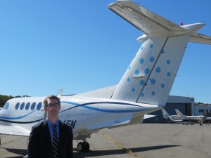 Beacon co-founder and CEO Wade Eyerly with one of the company's planes at Westchester County Airport in Harrison.