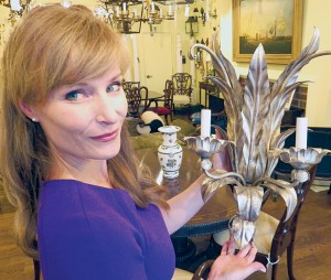 Jennifer Charlebois Martin, CEO and co-owner, The Federalist, with a hand-rubbed lighting fixture in the Greenwich store.