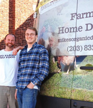 Mike Geller with associate Chris Kimball outside the Mike”™s Organic Delivery warehouse. Photo by Reece Alvarez