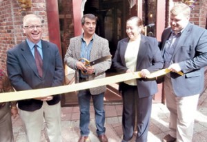 Danbury Mayor Mark Boughton, left, and the City Center Executive Director PJ Prunty, far right, help open La Mitad del Mundo restaurant.