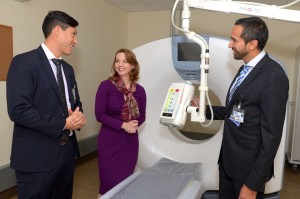 Dr. Rafael Torres, left, director of emergency medicine, and Dr. Farrukh Jafri show White Plains Hospital president and CEO Susan Fox a new CT scan at the newly opened White Plains Hospital Medical and Wellness center in Armonk. 
