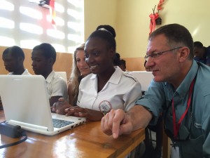 Tiffany Kuehner and Carl Kuehner with students in a BLT-sponsored computer lab in Haiti.