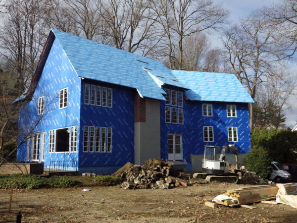 The blue-wrapped house on Old Church Road in Greenwich.