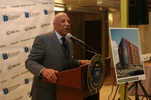Mount Vernon Mayor Ernest Davis extols the benefits of 42 Broad Street West, an $85 million development shown in architect”™s rendering at right, in his final days in office in December.   