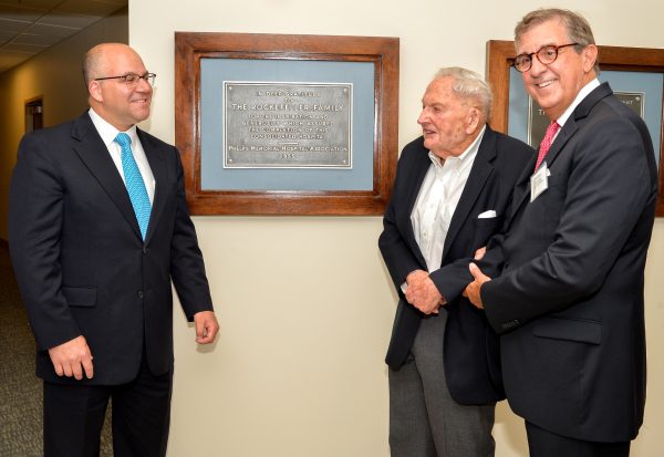 Shown in front of newly displayed plaques that date to the founding of Phelps Hospital are, from left, Daniel Blum, Phelps president and CEO; philanthropist David Rockefeller, and Richard Sinni, Phelps board chairman.