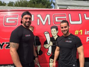 Partners Jimmy Bonavita, left, and Sam Langer with one of their GYMGUYZ vans that bring personal trainers and fitness equipment to clients' homes and workplaces. 