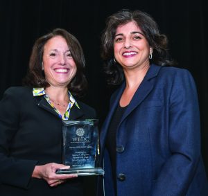 Women with Impact Award recipient Seema Hingorani, Founder and Chair, Girls Who Invest, Inc. (R) and Jill Hummel, WBDC Breakfast Chair, Pres. Anthem Blue Cross & Blue Shield (L).