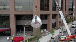 Hoisting the sculpture into place.