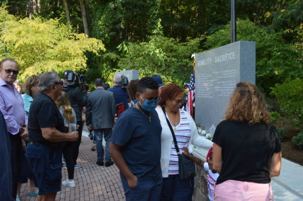 Family members and friends at unveiling of new 9/11 First Responders Memorial at the Kensico Dam Plaza in Valhalla. Photo by Peter Katz.