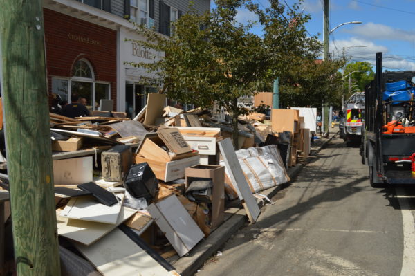 Sone of the trash from Mamaroneck Avenue businesses in Mamaroneck on Sept. 3 after the recent flooding. Photo by Peter Katz.
