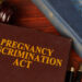 New Rochelle financial executive says German firm fired her for pregnancy