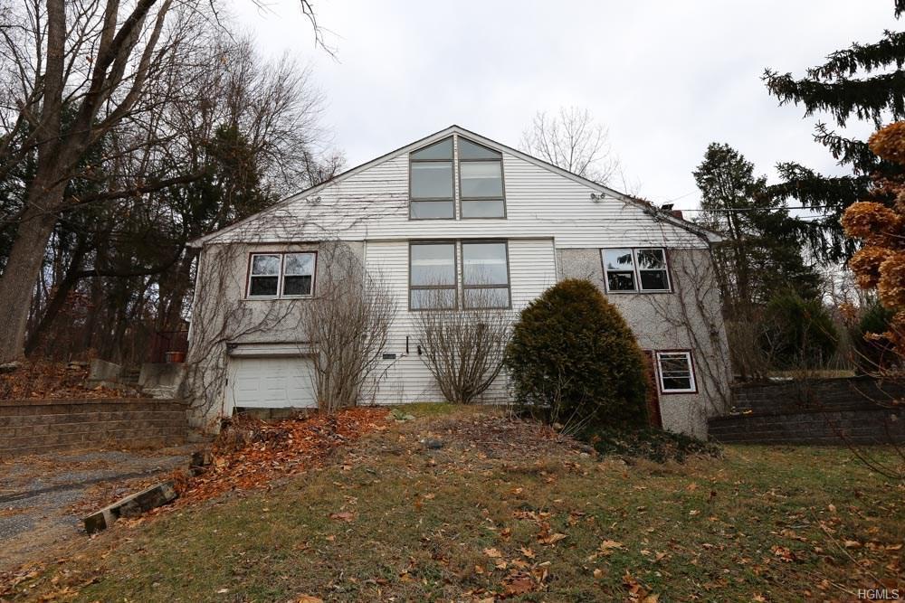 Daughter claims father forged signature and took her Brewster house