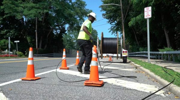 Installing fiber-optic cable for an Altice system.