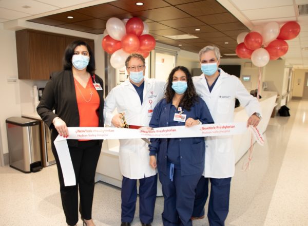 Cutting the ribbon, from left: Angela Gonzalez-Perez, vice president, operations; Giora Weisz; Lorrena Kirkwood, patient care director, interventional radiology and interventional cardiology; William Prabhu, associate medical director of interventional cardiology.