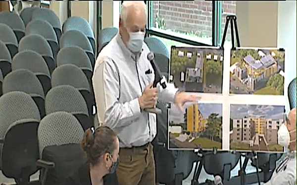 Architect Douglas Cutler shows renderings to Greenburgh Town Board members.