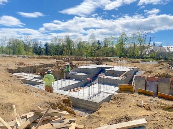 Foundation and above-ground construction work beginning at Bellefield.