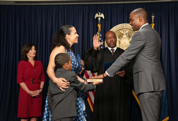 Gov. Hochul, far left, with Delgado's family as Delgado takes oath of office as Lt Gov. on May 25.