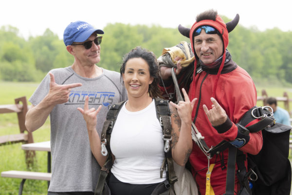 Jason Adsit, president of Mount Saint Mary College, left, with wife Heather and skydive instructor at Skydive The Ranch in Gardiner. Photo by Lee Ferris.