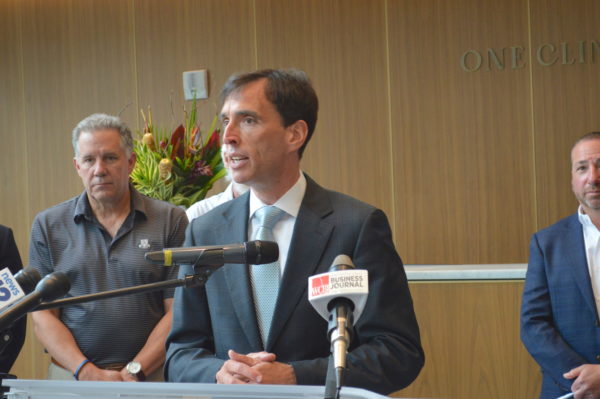 New Rochelle Mayor Noam Bramson speaks at ribbon-cutting for One Clinton Park. Photo by Peter Katz.