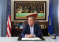 Monroe resident delivers petition to halt electric public benefits charges